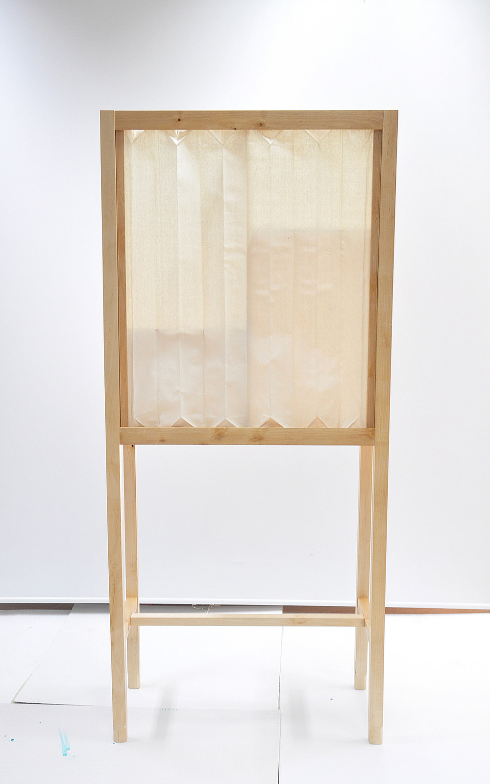 Dackelid Form - The cabinet has doors and sides made of raw silk dipped in a mix of wood glue and water to get the stiffness to make the creases