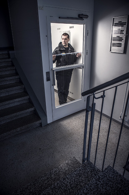 Vesa Tyni - The elevator agent Simo Merilä measures an elevator during his daily work routine.