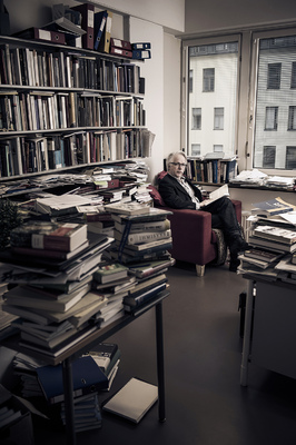 Vesa Tyni - Professor of legal history Jukka Kekkonen reads a book after his lunch break at his office.