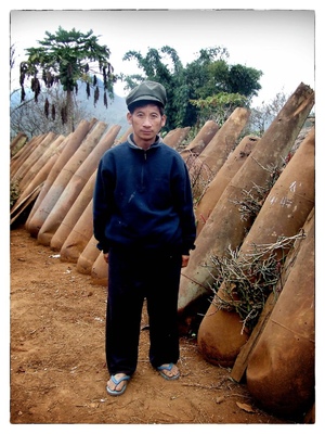 Andrew Bannerman-Bayles - Laotian Villager and American bomb canisters Laos